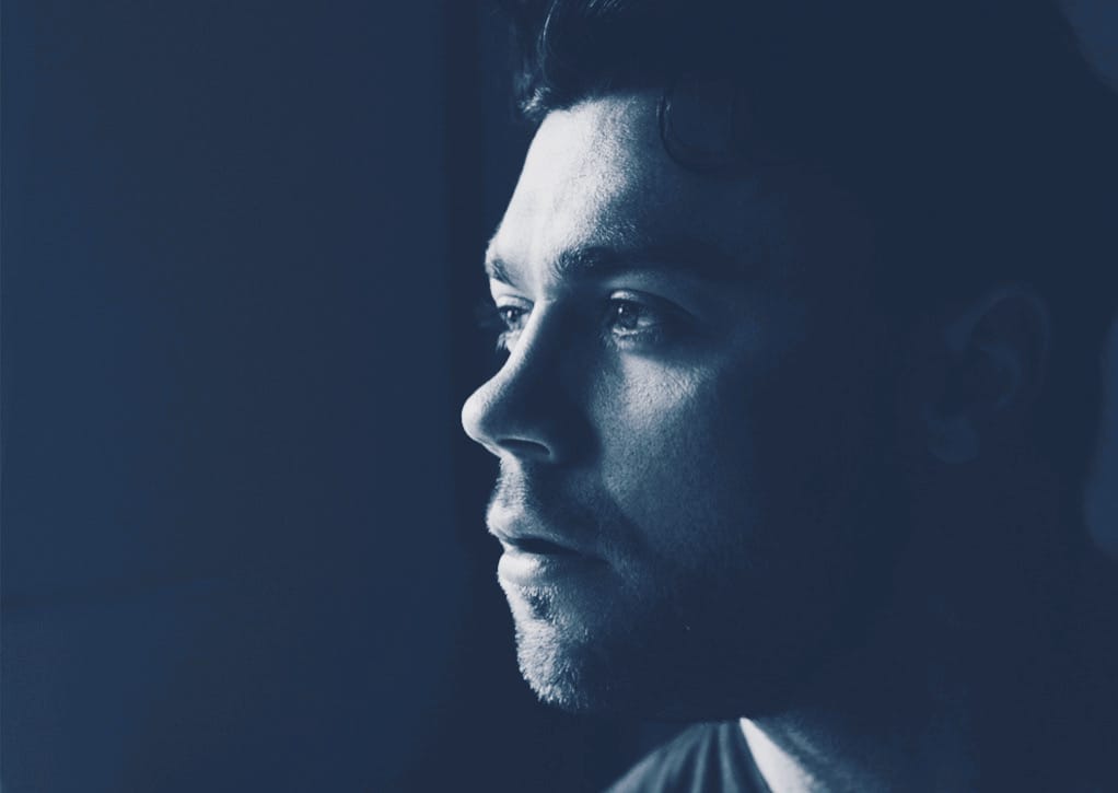 Black and white profile of middle-aged Hispanic man's face