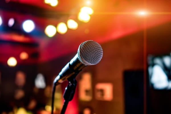 Microphone on stand in venue set up for karaoke